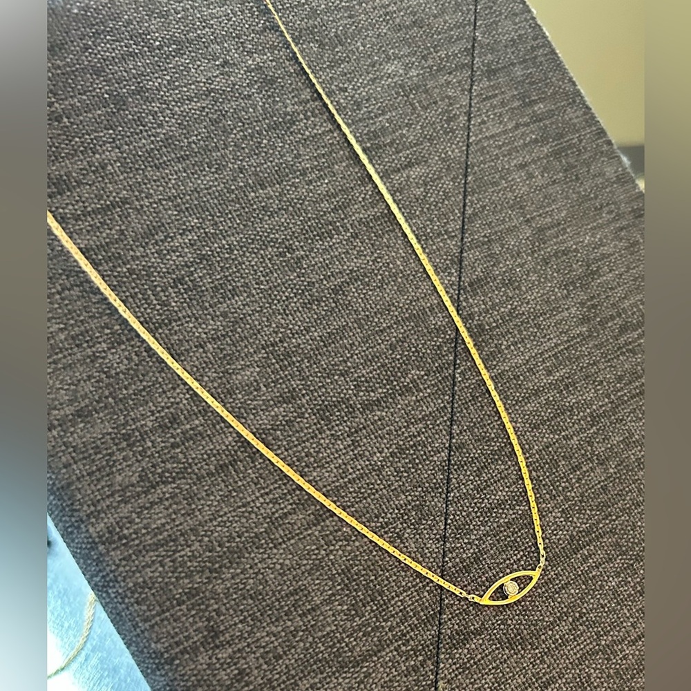 Solid 14kgold & diamond “Eye” necklace.